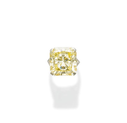 AN IMPRESSIVE COLOURED DIAMOND AND DIAMOND RING, BY VAN CLEEF & ARPELS