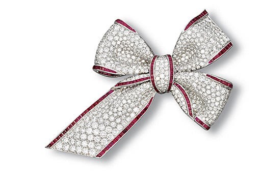 A DIAMOND AND RUBY BOW BROOCH, BY TIFFANY & CO.