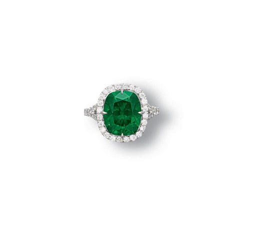 A DEMANTOID GARNET AND DIAMOND RING