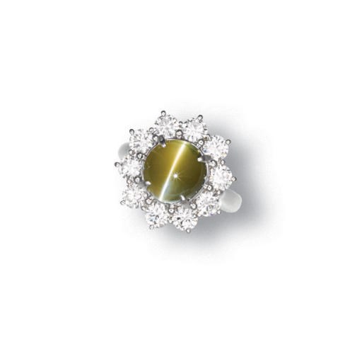 A CAT'S EYE CHRYSOBERYL AND DIAMOND RING