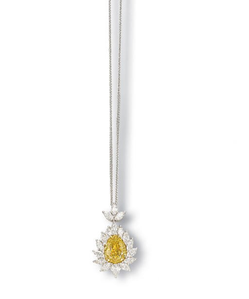 A COLOURED DIAMOND AND DIAMOND PENDENT NECKLACE