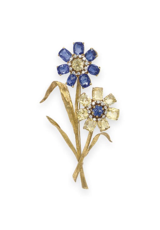 A MULTI-COLORED SAPPHIRE AND DIAMOND FLOWER BROOCH