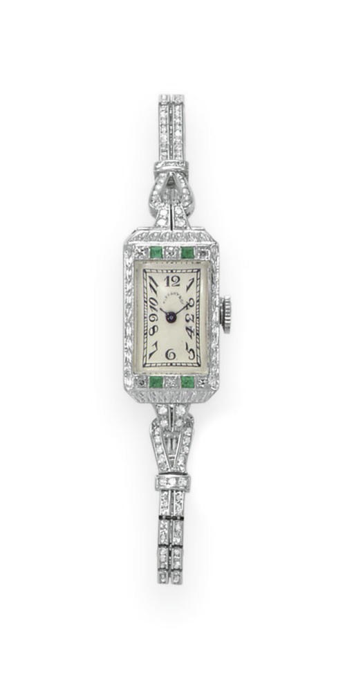 AN ART DECO DIAMOND AND EMERALD BRACELET-WATCH, BY TIFFANY & CO.