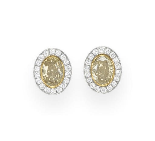 A PAIR OF COLORED DIAMOND EAR CLIPS