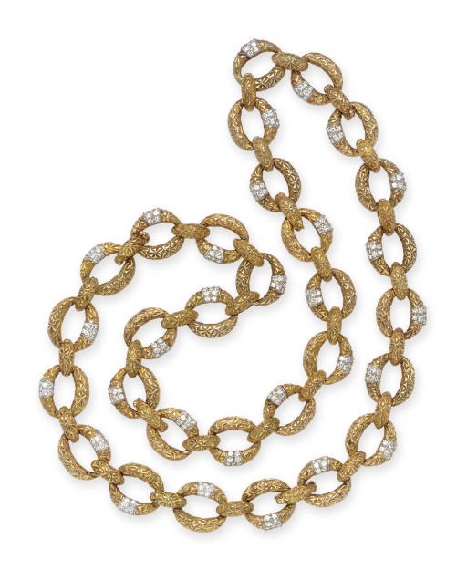 A GOLD AND DIAMOND LONGCHAIN NECKLACE
