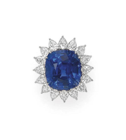 AN IMPRESSIVE SAPPHIRE AND DIAMOND RING, BY CARTIER