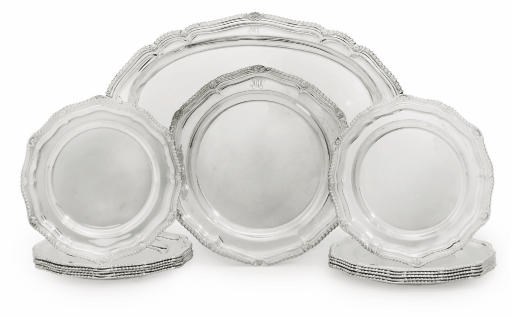 A SET OF TWELVE ELIZABETH II SILVER DINNER-PLATES WITH A MEAT-DISH AND A SECOND COURSE-DISH EN SUITE