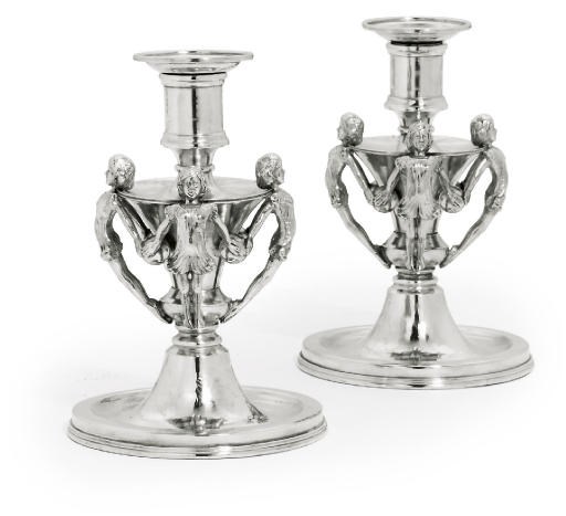 'THE CHILD NYMPH CANDLESTICKS'
A PAIR OF EDWARD VIII SILVER CANDLESTICKS