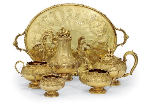 A FIVE-PIECE GEORGE IV AND LATER SILVER-GILT TEA AND COFFEE SERVICE WITH A TRAY EN SUITE