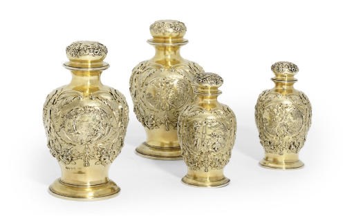 LOUISA, VISCOUNTESS BERESFORD'S TOILET SERVICE
A SET OF FOUR GEORGE IV SILVER-GILT DRESSING TABLE-BOTTLES