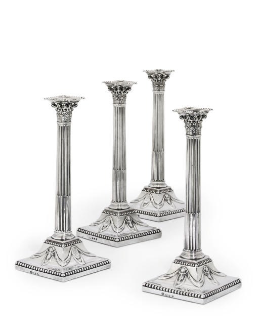 A SET OF FOUR GEORGE III SILVER CANDLESTICKS