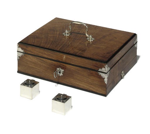 A GEORGE II SILVER AND EBONY MOUNTED PADOUK WRITING BOX