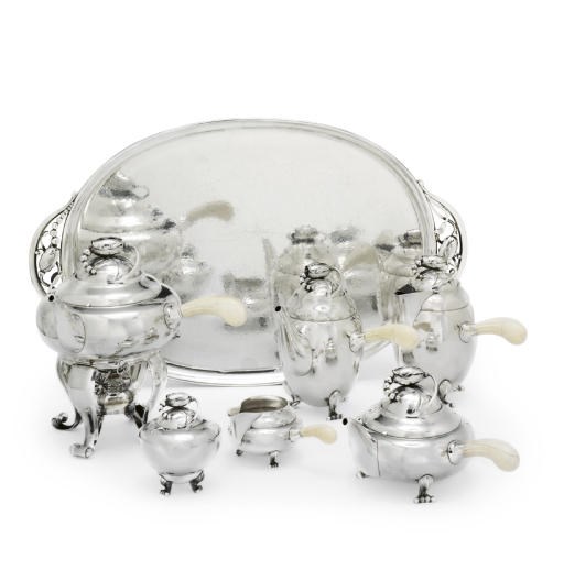 A DANISH SIX-PIECE TEA AND COFFEE SERVICE WITH A TRAY EN SUITE