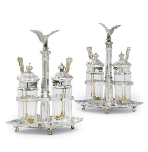 A PAIR OF GERMAN SILVER-GILT MOUNTED MUSTARD-CRUETS AND FOUR CONDIMENT-SPOONS
