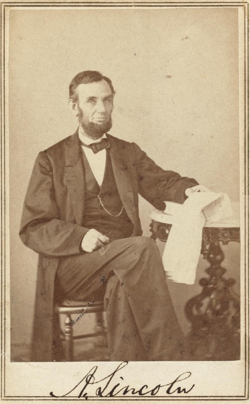 LINCOLN, Abraham. GARDNER, Alexander, Photographer. Carte-de-visite photograph signed ("A. Lincoln") as President, backstamp of "Gardner...Washington. D.C.," [taken 9 August 1863]. Albumen photograph, 3 15/16 x 2 3/8 in., neatly mounted on stiff card within double ruled borders, boldly signed in the blank area beneath the image, minor scratch at lower left, verso with remnants of old mount. Hamilton and Ostendorf, Lincoln in Photographs, 0-72D.