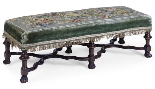 A WALNUT AND NEEDLEWORK UPHOLSTERED LONG STOOL