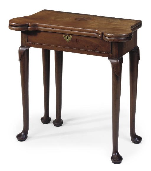 A GEORGE II MAHOGANY GAMES TABLE