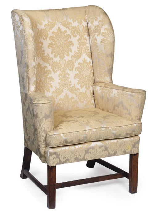 A GEORGE III MAHOGANY WING ARMCHAIR