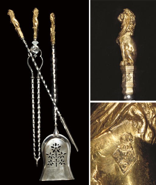 A SET OF THREE VICTORIAN STEEL AND GILT-BRONZE FIRE IRONS