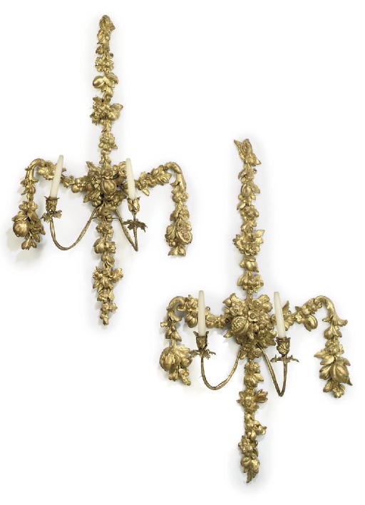 A PAIR OF GEORGE II GILTWOOD GESSO TWIN-LIGHT WALL LIGHTS