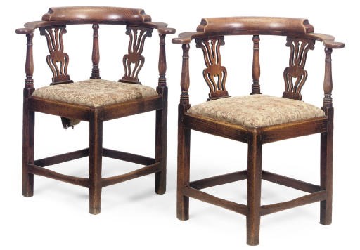 A PAIR OF GEORGE III PROVINCIAL ELM CORNER ARMCHAIRS