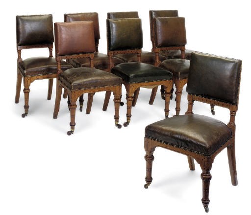 A SET OF EIGHT VICTORIAN OAK AND LEATHER UPHOLSTERED DINING CHAIRS