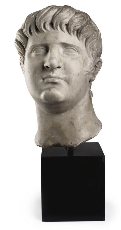 A CARVED MARBLE BUST OF CAESAR