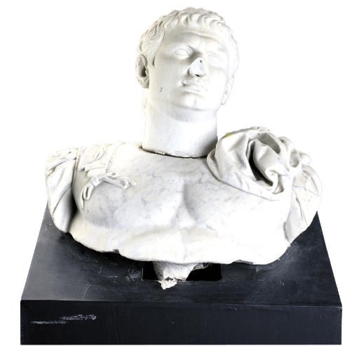 A CARVED MARBLE BUST OF CAESAR
