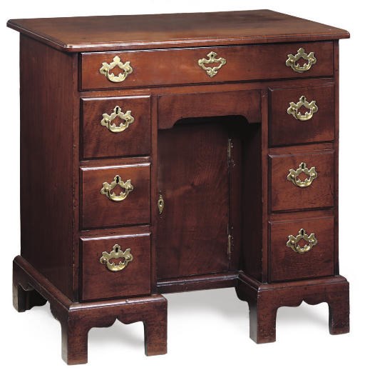 A GEORGE III MAHOGANY KNEEHOLE DESK