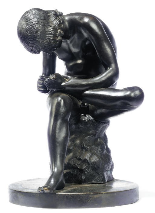 AN ITALIAN BRONZE FIGURE OF SPINARIO
