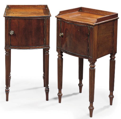 A MATCHED PAIR OF REGENCY MAHOGANY BOWFRONT BEDSIDE CUPBOARDS