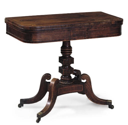 A REGENCY ROSEWOOD AND GRAINED GAMES TABLE