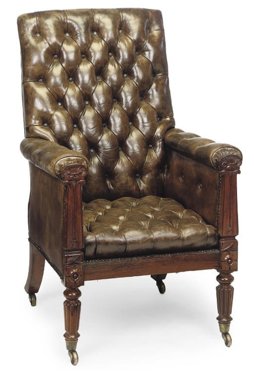 A GEORGE IV ROSEWOOD LIBRARY ARMCHAIR