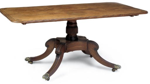 A REGENCY MAHOGANY AND LINE INLAID BREAKFAST TABLE