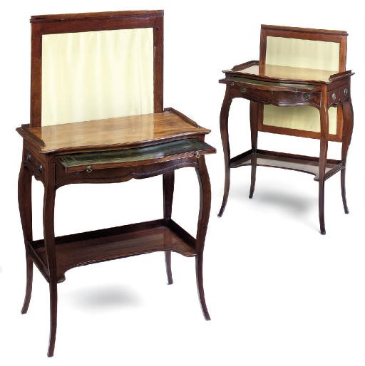 A MATCHED PAIR OF GEORGE III MAHOGANY LADY'S CHEVAL SERPENTINE WRITING TABLES
