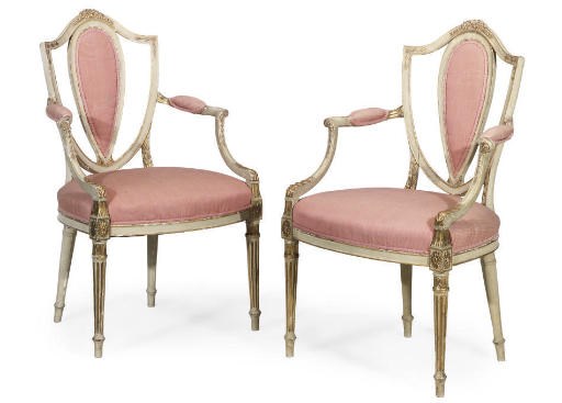 A PAIR OF CREAM PAINTED AND GILT-HEIGHTENED ARMCHAIRS