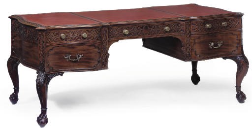 A VICTORIAN MAHOGANY SERPENTINE PARTNERS' DESK