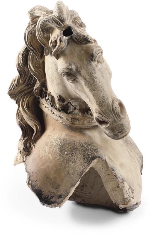 AN ARTIFICIAL STONE UNICORN HEAD FRAGMENT