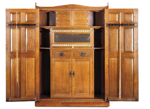 AN EDWARDIAN OAK SNOOKER OR BILLIARDS CABINET