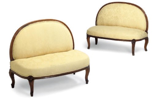 A PAIR OF MID-VICTORIAN WALNUT WINDOW SEATS OR BANQUETTES