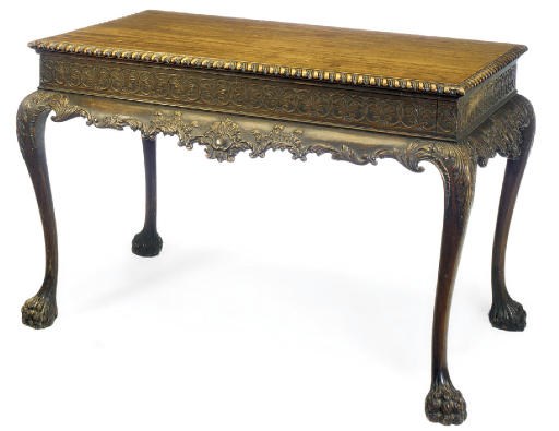 A CARVED MAHOGANY CENTRE TABLE