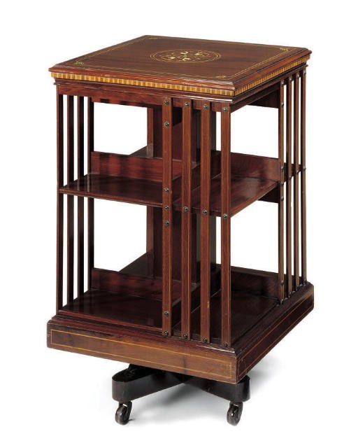 AN EDWARDIAN MAHOGANY AND MARQUETRY REVOLVING BOOKCASE