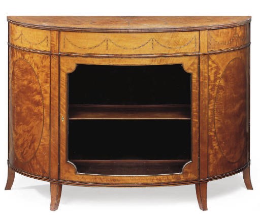 AN IRISH SATINWOOD AND MARQUETRY SEMI-ELIPTICAL COMMODE