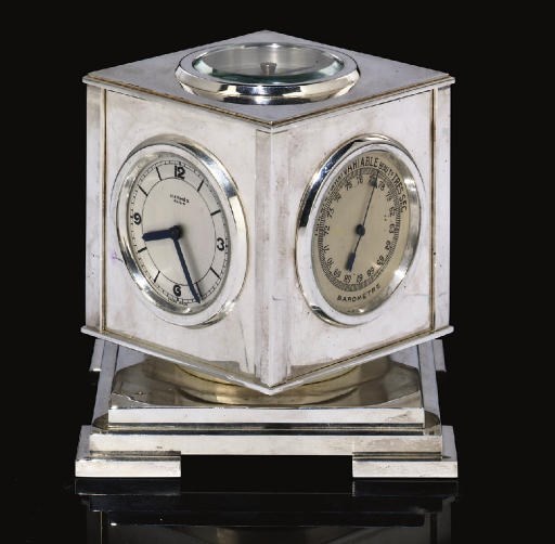 A CHROME-PLATED REVOLVING DESK WEATHER STATION