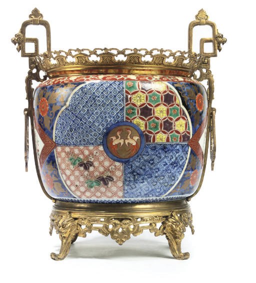 A FRENCH GILT-BRONZE MOUNTED PORCELAIN JARDINIERE