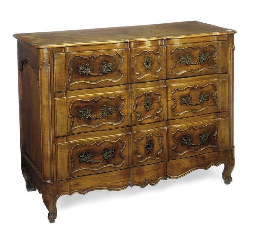 A FRENCH PROVINCIAL WALNUT SERPENTINE COMMODE