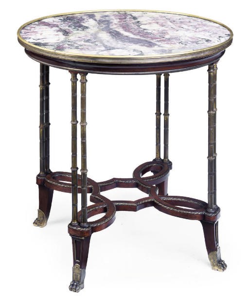 A FRENCH GILT BRONZE MOUNTED MAHOGANY GUERIDON