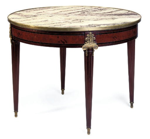 A FRENCH GILT METAL MOUNTED MAHOGANY, AMBOYNA AND EBONY CENTRE TABLE