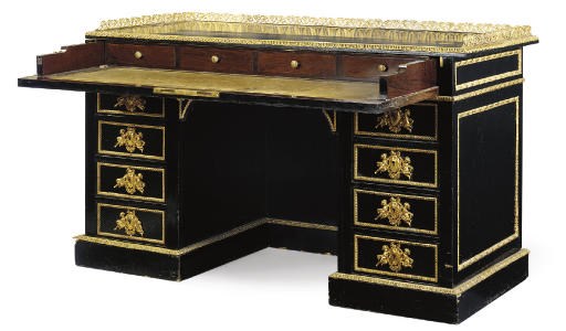 A NAPOLEON III GILT-METAL MOUNTED AND EBONISED KNEEHOLE DESK