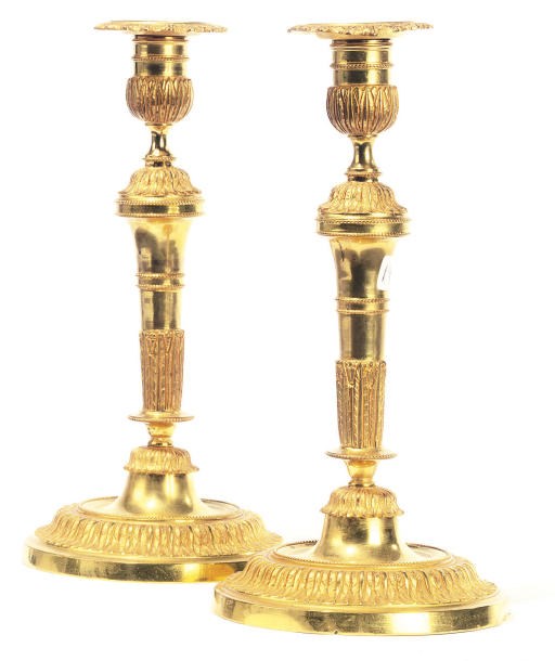 A PAIR OF FRENCH GILT-BRONZE CANDLESTICKS